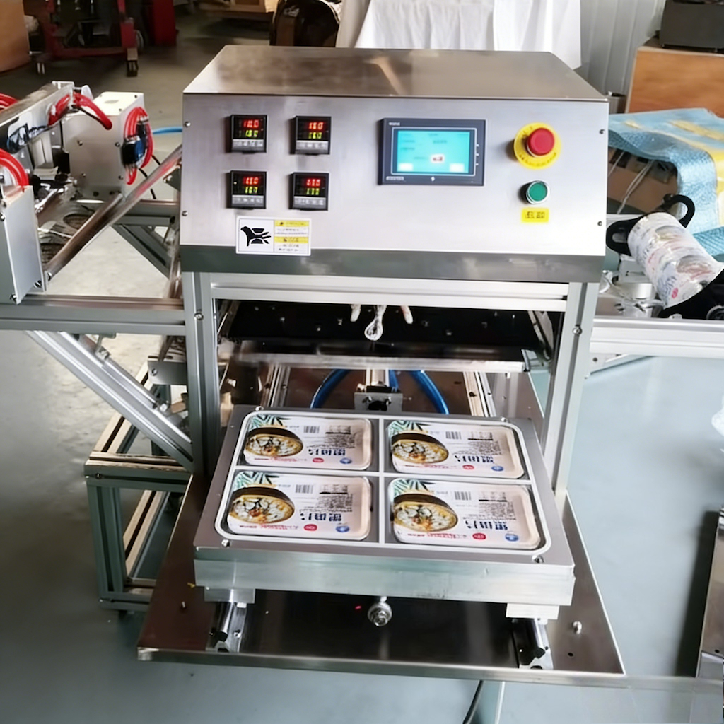 Tray sealing equipment with multiple filled trays on a mold in a workshop